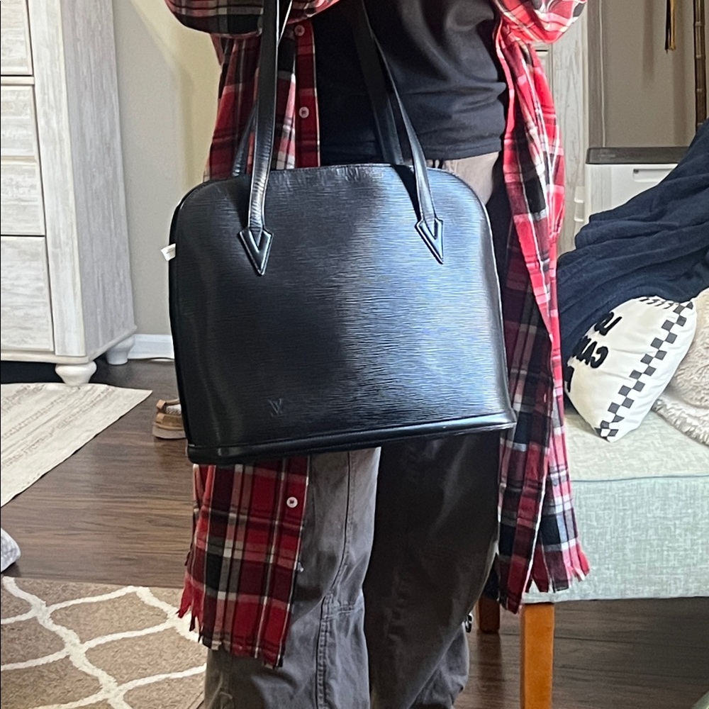 Louis Vuitton Epi Lussac leather handbag
Louis Vuitton Leather Tote AS0052